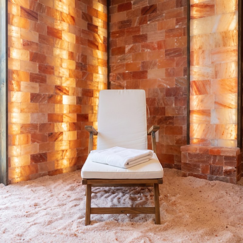 Loungers in front of the glowing Himalayan salt wall