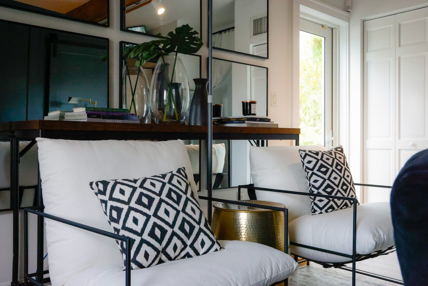 The member lounge with white sofas and patterned cushions